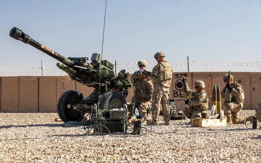 U.S. soldiers conduct an artillery live fire exercise at Al Asad Air Base, Iraq, on Dec. 1.