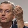 VA Secretary nominee Doug Collins holds up his dogtags on Tuesday, Jan. 21, 2025 during his confirmation hearing at the U.S. Senate Committee on Veteran Affairs in Washington. Eric Kayne/Stars and Stripes)