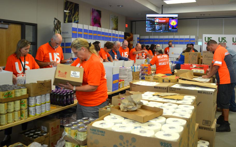 Volunteers on Wednesday, Sept. 11, 2024, fill 240 boxes with household essentials and food to give to military families who recently moved to Fort Cavazos. 