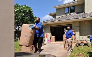 Household goods inspector Faata Leafa watches a mover with Aloha International pack up a home in Honolulu on May 5, 2020.