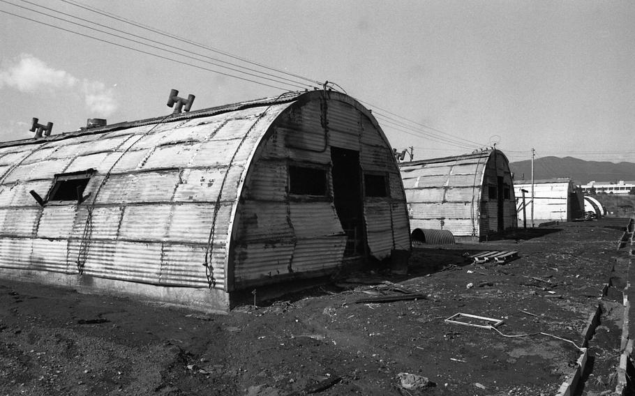 Burned Quonset huts at Camp Fuji