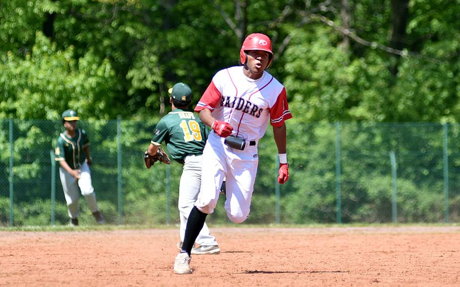 Kaiserslautern junior Rueben Todman runs toward third base to complete a triple during the first inning of the second game of a doubleheader against SHAPE on May 11, 2024, at Pulaski Park in Kaiserslautern, Germany.