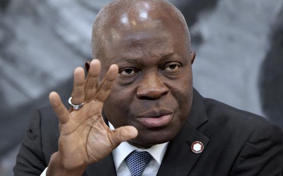 FILE - Gilbert Houngbo, Director General of the International Labour Organization (ILO), addresses the media during a press conference in Berlin, Germany, Tuesday, Nov. 29, 2022.  (AP Photo/Michael Sohn, File)