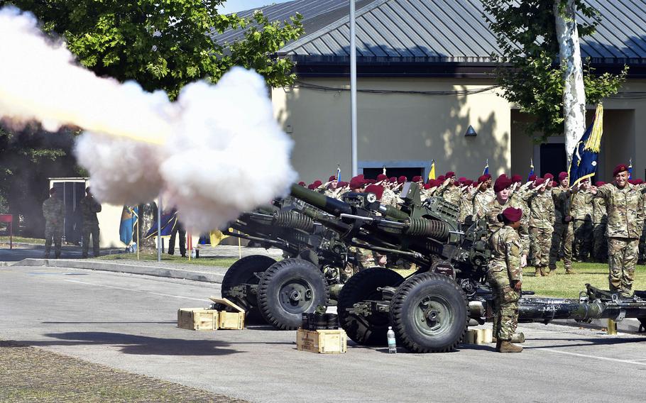 Soldiers assigned to the 4th Battalion, 319th Airborne Field Artillery Regiment fire an M119A2 howitzer during a change of command ceremony at Caserma Ederle in Vicenza, Italy, on July 18, 2024.