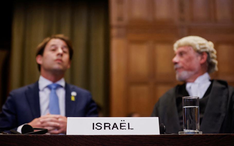 British jurist Malcolm Shaw and Yaron Wax look on at the International Court of Justice, during a ruling on South Africa’s request to order a halt to Israel’s Rafah offensive in Gaza as part of a larger case brought before the Hague-based court by South Africa accusing Israel of genocide, in The Hague, Netherlands May 24, 2024.
