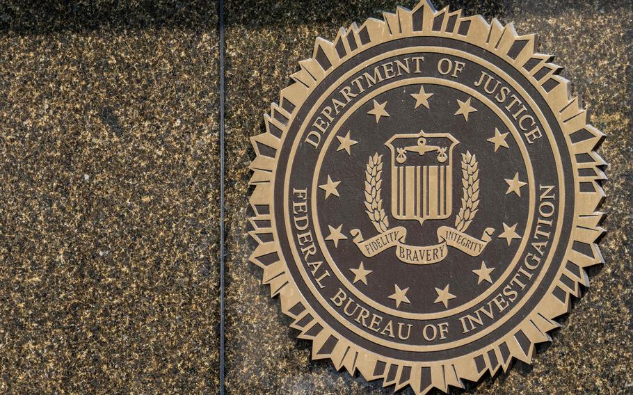 The seal of the FBI on the outside of a building.