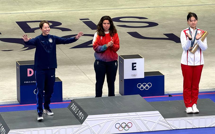 Army Sgt. Sagen Maddalena smiles and waves to the crowd before accepting her silver medal after placing second in the women’s 50-meter three-position rifle competition at the 2024 Paris Olympics, Friday, Aug. 2, 2024. Chiara Leone of Switzerland took the gold medal, while China’s Qiongyue Zhang finished third at Chateauroux Shooting Centre in Chateauroux, France.