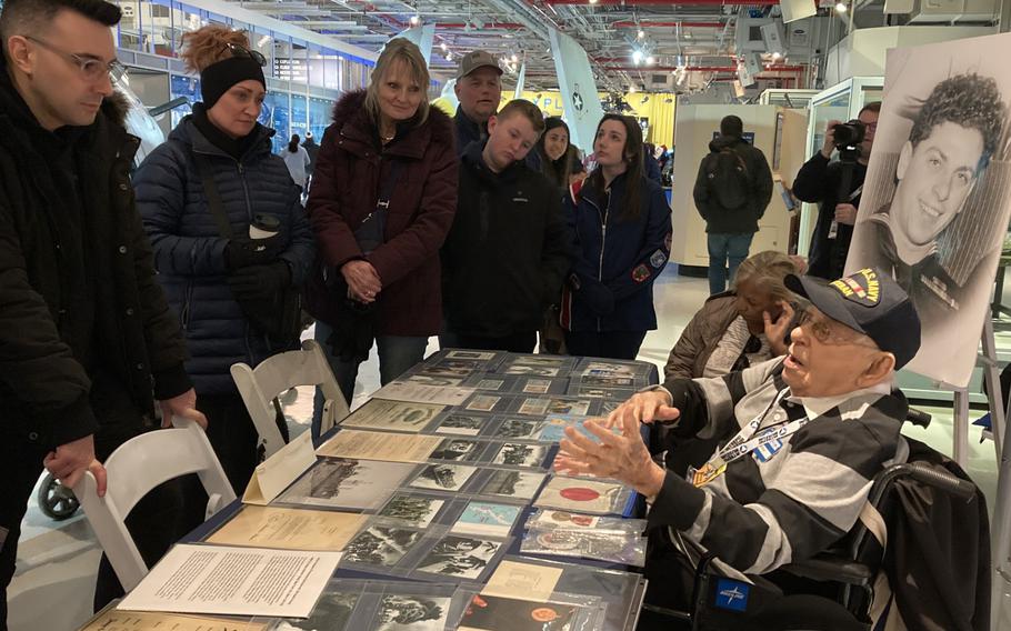 Arthur Grabiner with his collection of world war ii photos and documents 