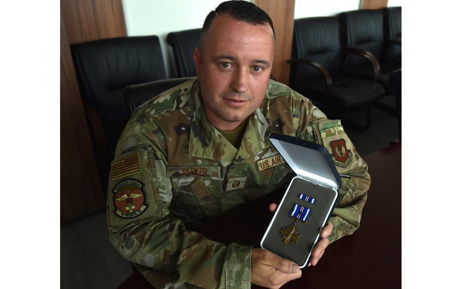 Master Sgt. Matthew Parker with his Distinguished Flying Cross with a “C” device 