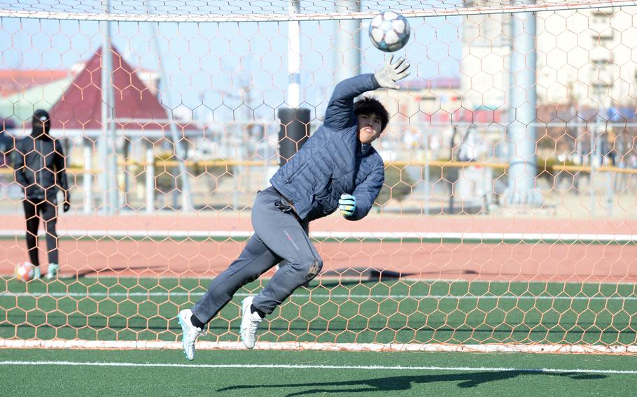 Llance Ramos stretches to save a shot on goal.