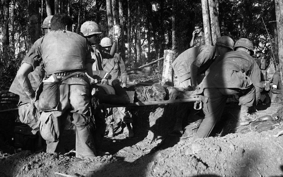 A wounded soldier is put on a stretcher