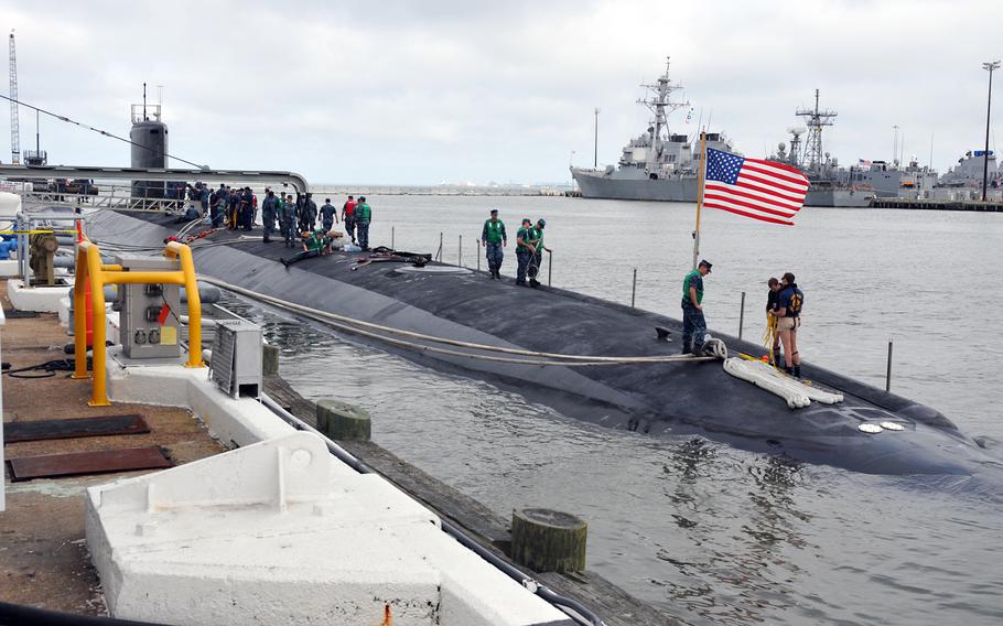 The Virginia-class attack submarine Pre-Commissioning Unit Minnesota (SSN 783) pulls pierside at Naval Station Norfolk from a scheduled underway on June 24, 2013.