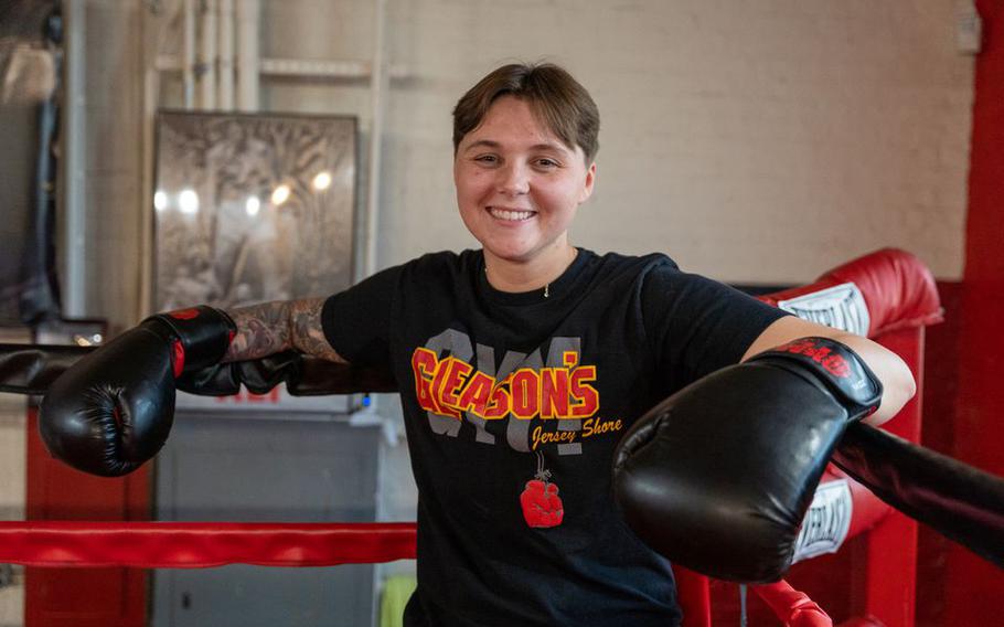 Maddison Van Der Mark, a U.S. Army veteran and Rutgers University student, poses for a photograph inside a boxing ring at New Jersey Give a Kid a Dream at Gleason’s Gym Jersey Shore in Long Branch, N.J., on May 8, 2023. The nonprofit organization helps at-risk youth through boxing and life lessons.