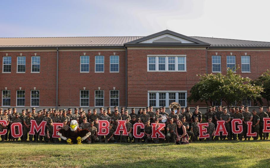 U.S. Marines pose with Crossroads Elementary School staff during a back-to-school celebration at the Crossroads Elementary School on Marine Corps Base Quantico, Va., Aug. 21, 2024. 