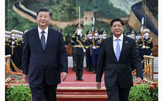 FILE - In this photo released by Xinhua News Agency, Chinese President Xi Jinping and visiting Philippine President Ferdinand Marcos Jr. appear together during a welcoming ceremony at the Great Hall of the People in Beijing on Jan. 4, 2023. (Shen Hong/Xinhua via AP, File)