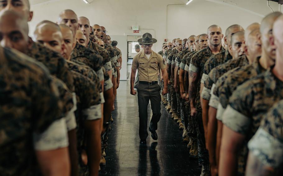 New Marines line up for inspection from a staff sergeant.