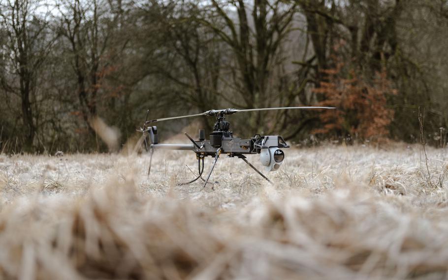 A U.S. Army Ghost reconnaissance drone sits in a field.