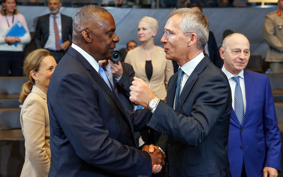 Defense Secretary Lloyd Austin talks with NATO Secretary-General Jens Stoltenberg at NATO headquarters in Brussels.