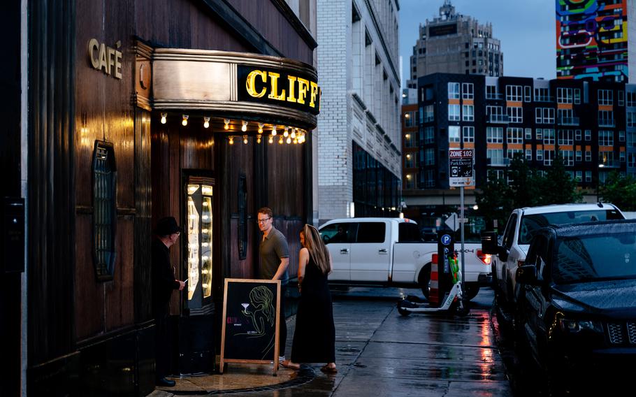 Guests enter Cliff Bell’s, a historic jazz club in Detroit. This bar has hosted many Motown alumni — and still presents an annual “Amplify” singing contest. Performing here is a rite of passage for any up-and-coming blues or jazz musician.