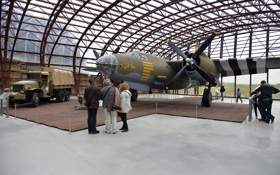 Visitors to the Utah Beach Museum study the Martin B-26 Marauder. This plane did not see action during the invasion, but Marauders played a major role in the preparation to D-Day.