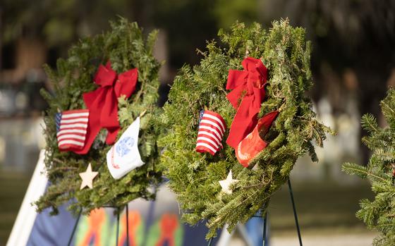 Ceremonial wreaths sit at the Beaufort National Cemetery in Beaufort, South Carolina, during a Wreaths Across America remembrance wreath placing ceremony Dec. 17, 2021. Wreaths Across America honors military members and their families, and remembers those who served. Volunteers placed wreaths on fallen service members’ gravestones,  and displayed ceremonial wreaths for each branch of service. This year the Beaufort National Cemetery placed over 26,000 wreaths. (U.S. Marine Corps photo by Sgt. Cheyeanne Campbell)