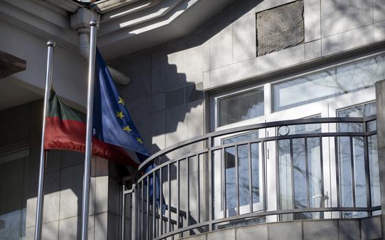 The Lithuanian and EU flags side-by-side outside of Lithuania’s Beijing embassy.