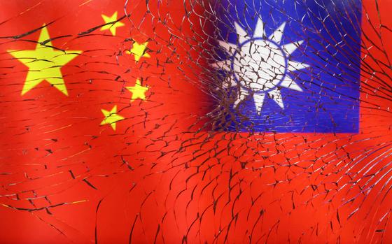Chinese and Taiwanese flags are seen through broken glass in this illustration taken on April 11, 2023.
