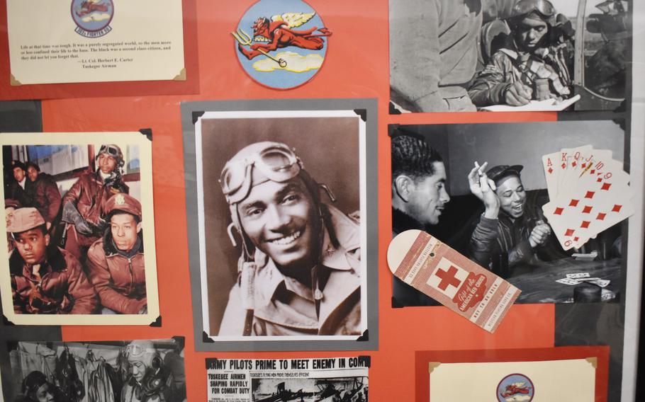 A group of photos of Tuskegee Airmen on a poster board.