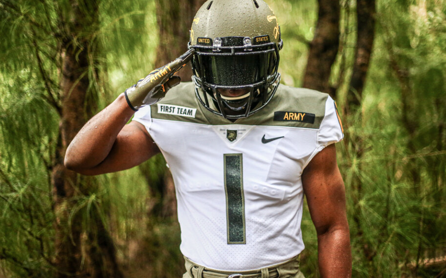 An Army football player wearing No. 1 salutes.