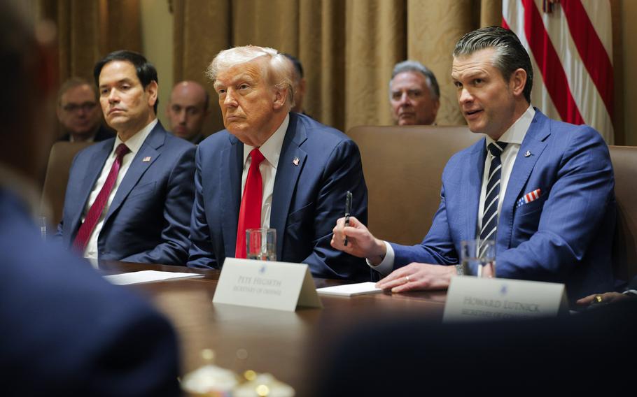 Marco Rubio, Donald Trump and Pete Hegseth at a table.