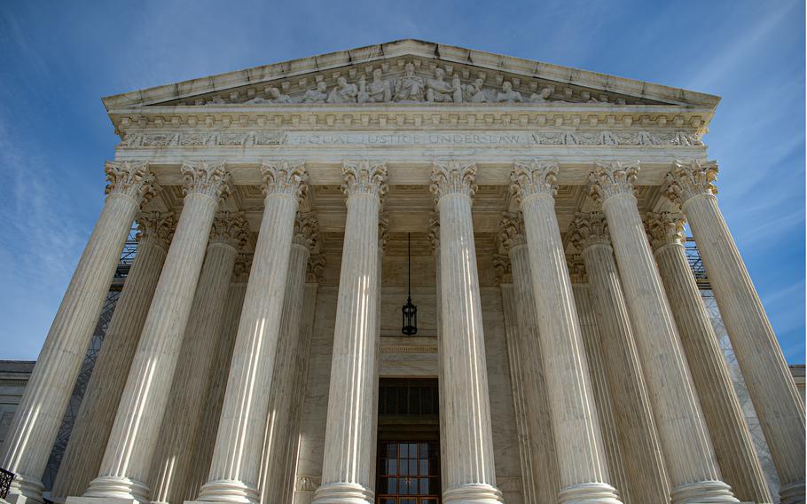 The U.S. Supreme Court building as viewed from its front and base.