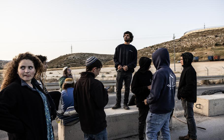 Israeli activists, including Yosef de Bresser, center, and 16-year-old Naama Tova, left, wait for food trucks at the Tarqumiyah crossing on May 17. 