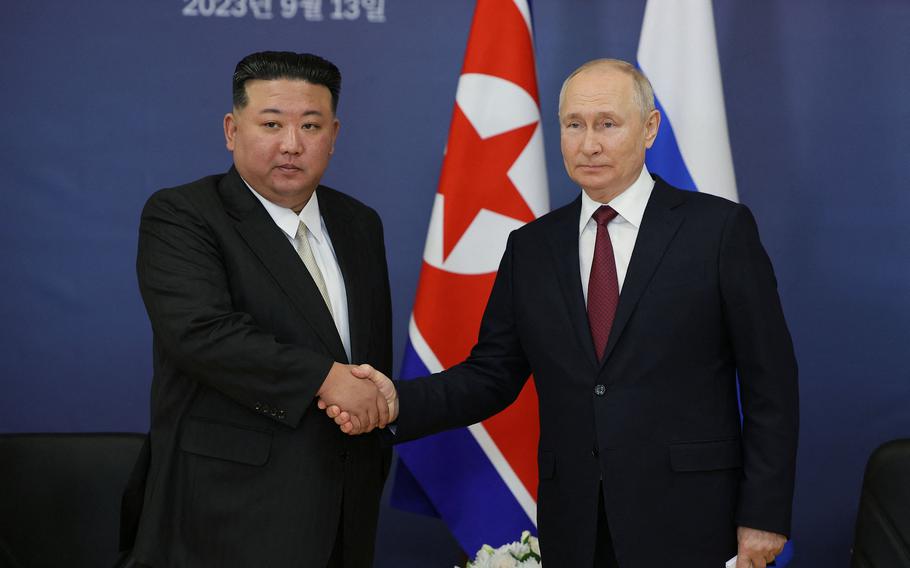 This pool image distributed by Sputnik agency shows Russia President Vladimir Putin, right, and North Korea leader Kim Jong Un shaking hands during their meeting at the Vostochny Cosmodrome in Russia’s Amur region on Sept. 13, 2023. 