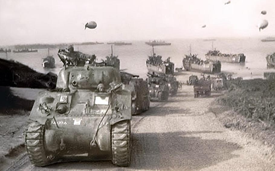 Tanks with 3rd Battalion, 33rd Armored Regiment, 3rd Armored Division, also known as Task Force Hogan, come ashore at Omaha Beach in Normandy, France, shortly after D-Day in 1944. 