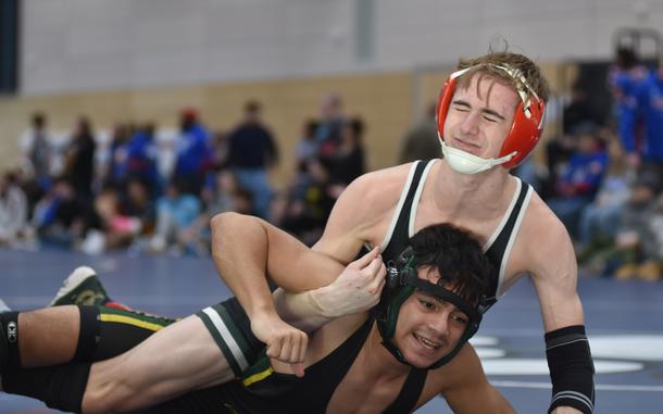 AFNORTH’s Logan Conrad gets on top of Alconbury’s Luis Payares during their bout at the DODEA-Europe wrestling sectional at Ramstein High School, Germany, on Feb. 1, 2025. Conrad won the match and went on to finish third in the 126-pound weight class.
