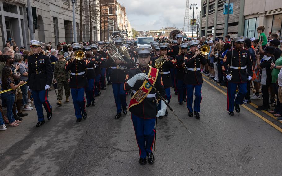 The Marine Forces Reserve Band marches through the city 