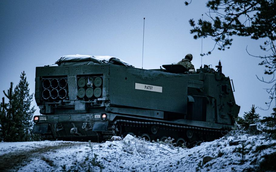 U.S. soldiers prepare to fire the M270A2 Multiple Launch Rocket System during  a winter exercise.