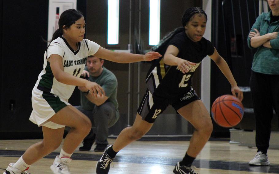 Mikayla Thomas and Aneya Aldan go for the ball.