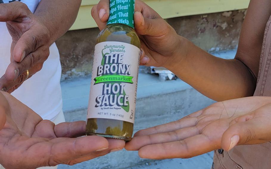 Members of the community-based Alternatives-to-Incarceration (ATI) initiative who are involved in growing food as well as the peppers for "The Bronx Hot Sauce" show of a bottle of Greenmarket sauce. Interest in gardening has grown around the country. And urban gardeners say it's particularly important for the health and resiliency of city neighborhoods. 