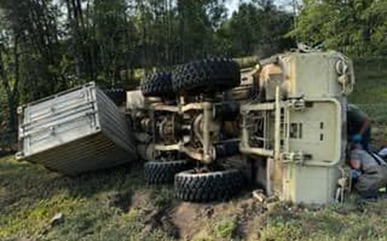 A picture of a rollover crash involving a military vehicle in Michigan