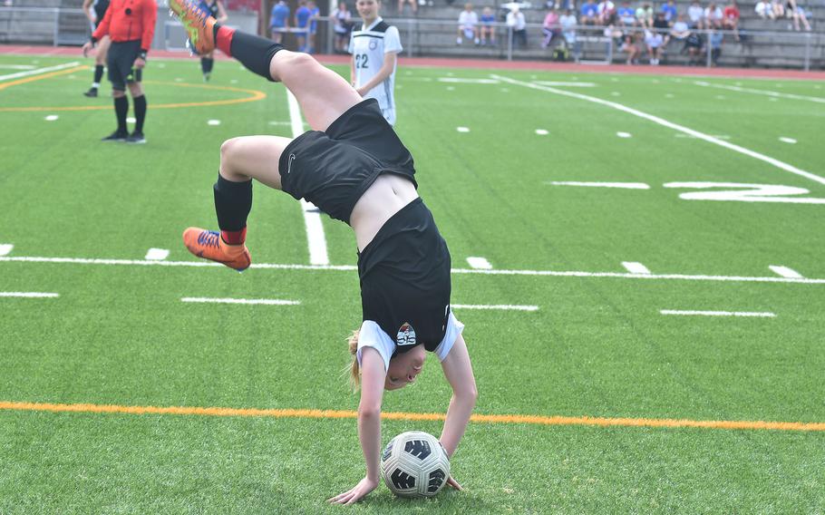 Stuttgart's Regan Stewart, a former gymnast, did a flip while tossing in the ball late in the Panthers' 5-0 victory over SHAPE on Monday, May 20, 2024, on the opening day of the DODEA European Division I girls soccer championships at Ramstein High School.