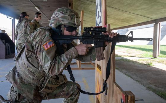 U.S. Army Spc. Brandon Lu, a signals intelligence analyst representing the Marietta-based 78th Troop Command, Georgia Army National Guard, shoots an M4A1 carbine during the weapons qualification event of the 2024 Georgia Army National Guard State Best Warrior Competition at the Catoosa Volunteer Training Site, Ringgold, Georgia, March 13, 2024. Georgia Army National Guardsmen and country of Georgia Defense Force soldiers strengthened their nearly 30-year partnership through competition while promoting esprit de corps and resiliency. (U.S. Army National Guard photo by Pfc. Alexandria Higgins)
