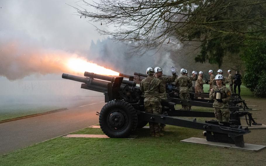 Cannons operated by U.S. soldiers fire.