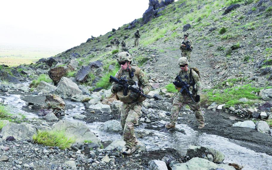 Sgt. Damon Miers and 1st Lt. James Kromhout begin a patrol along with other members