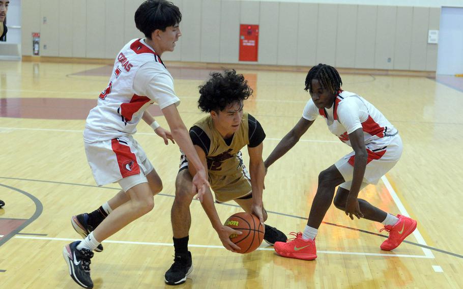 Nolan Grubb and Jeremy Phillips play defense.