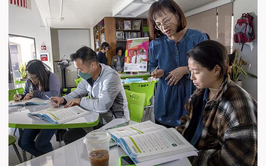 Kelly Chuang, standing, teaches Mandarin to Crystal Huang at Chinese School of San Marino on April 1, 2023.