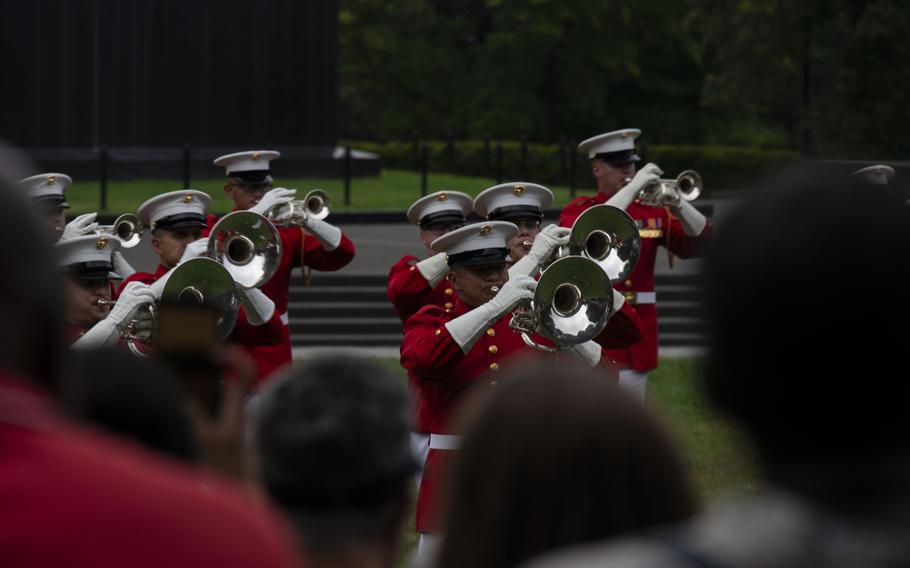 Marines with “The Commandant’s Own” U.S. Marine Drum & Bugle Corps, Marine Barracks Washington, execute their musical sequence during a Sunset Parade at the Marine Corps War Memorial, Arlington, Va., July 23, 2024. 