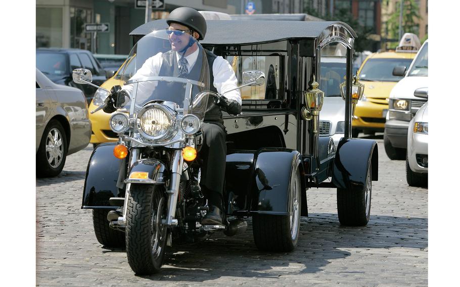 Peter Moloney rides his Harley Davidson hearse