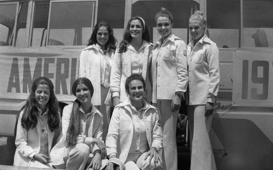 Seoul, South Korea, Aug. 8, 1973:  The "Miss America USO Show" troup members pose for photographers after their arrival in Korea for a 13-day swing of American military bases. Pictured are (from row, from left) Cathy Lawton, Miss Delaware; Sandra Herring, Miss Oregon; Becky Graham, Miss Indiana; (back row) Kathy Neff, Miss Maryland; Cindy Sikes, Miss Kansas; Terry Meeuwsen, Miss America 1973; and Dianne Wagner, Miss California.

Looking for Stars and Stripes’ historic coverage? Subscribe to Stars and Stripes’ historic newspaper archive! We have digitized our 1948-1999 European and Pacific editions, as well as several of our WWII editions and made them available online through https://starsandstripes.newspaperarchive.com/

META TAGS: Pacific; entertainment; USO; variety show; Miss America; beauty queen; tour; bus
