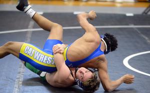 Kubasaki's Tim Cope tilts CAJ's Timon Fambro with a gut wrench at 133 pounds.